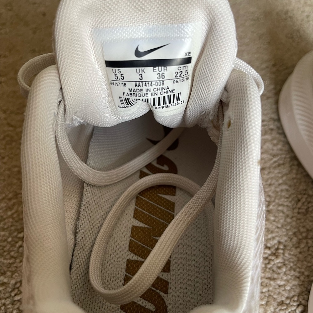 Nike woman’s White and Gold Sneakers